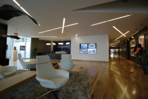 digital sign display featured on the wall of an office lobby setting