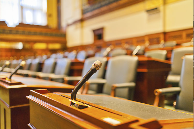 Courtroom witness stand with a mounted microphone