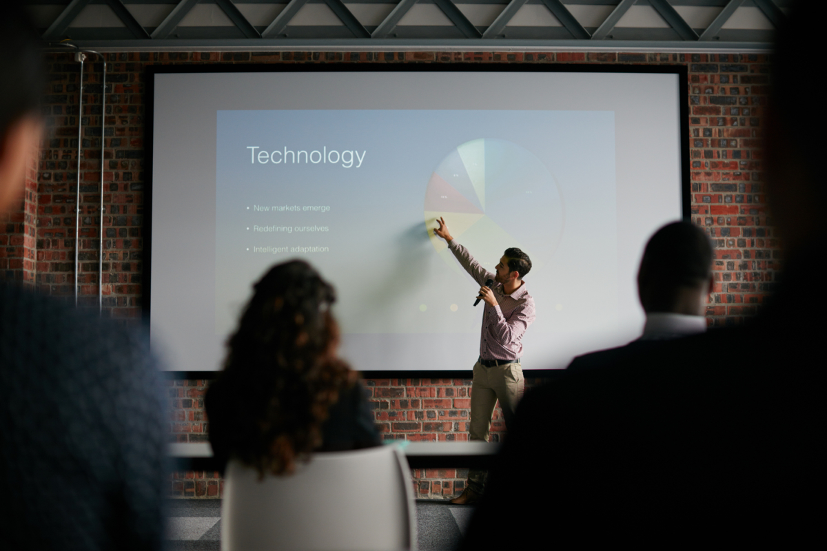 Presenting key notes to his colleagues Shot of a businessman giving a presentation to his colleagues