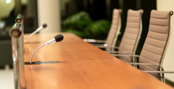 Isolated,View,Of,A,Microphone,In,A,Meeting,Room,On courtroom microphones