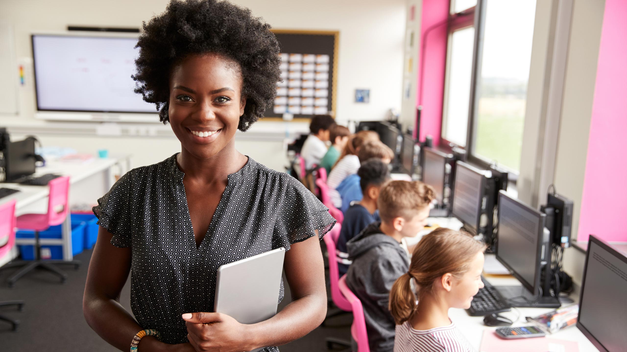 woman teaching tech classroom