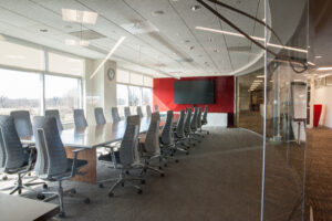 Paris AV Services red conference room with a glass wall
