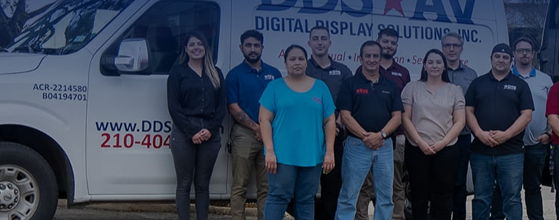 digital technology solutions team members in front of DDS-AV vans
